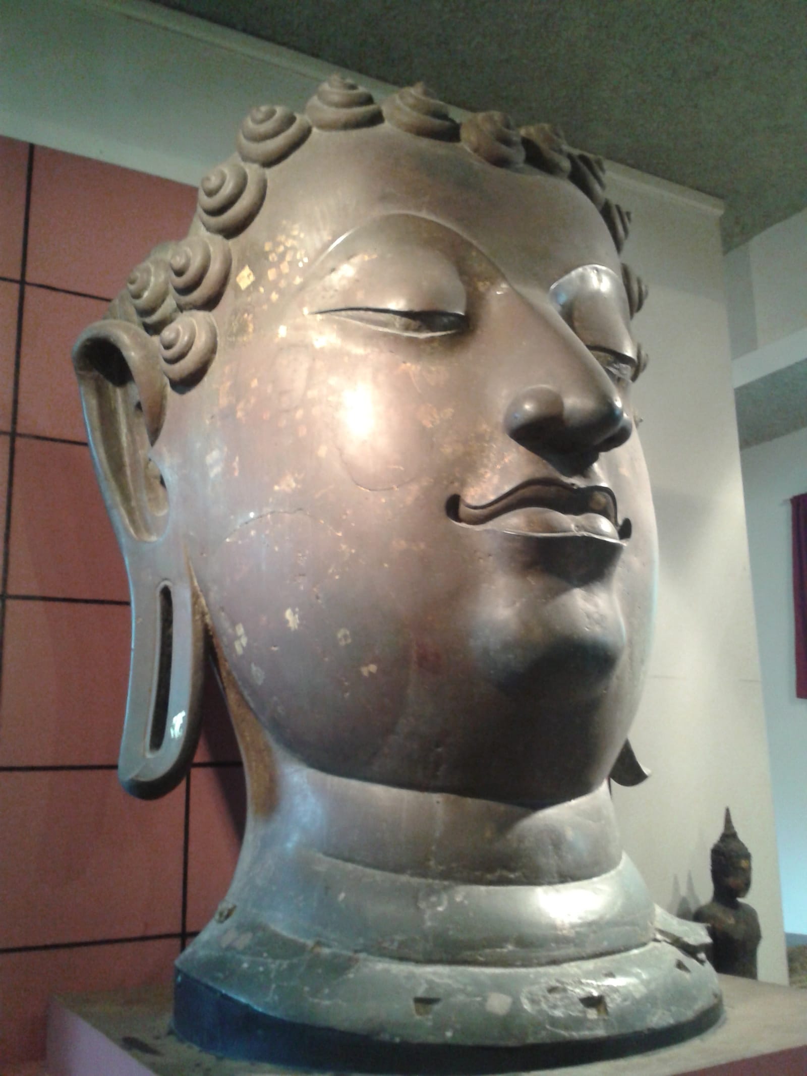 Phra Saen Sae, a monumental fifteenth-century bronze Buddha image from Wat Yang Kuang, on display in the museum's Lanna galleries